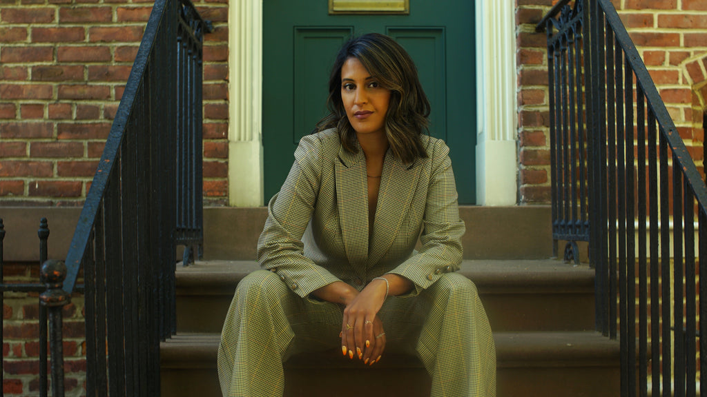 DALYA founder and CEO Farida Raafat in houndstooth tan suit
