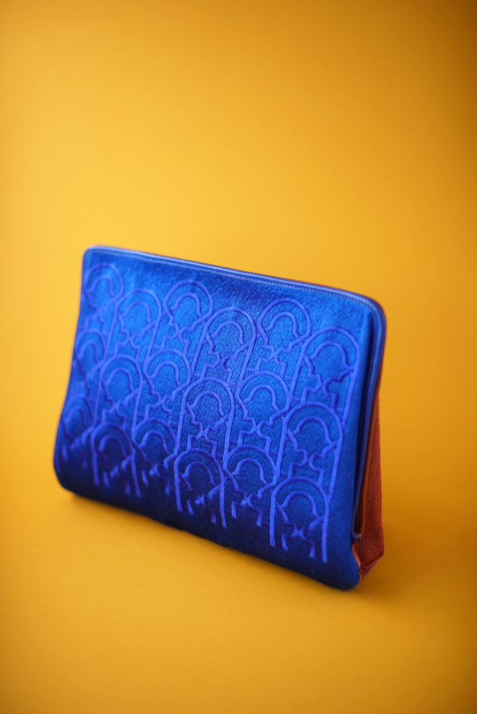suede clutch with a letter embroidery in custom electric blue and brown